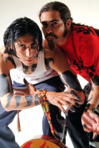 Mezklah hand-paint tribal illustrations all over the duo’s bodies before every show